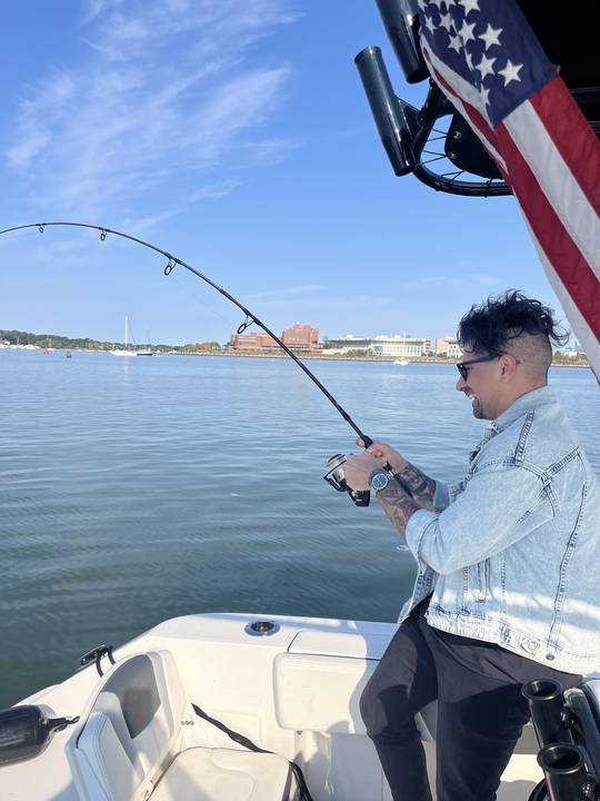 Hooked up with the rod bent over, flag flying off the T-top