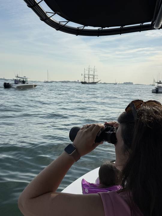 Watching a tall ship come in through the binoculars