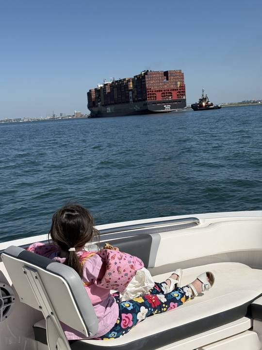 Watching a container ship and its tug go by