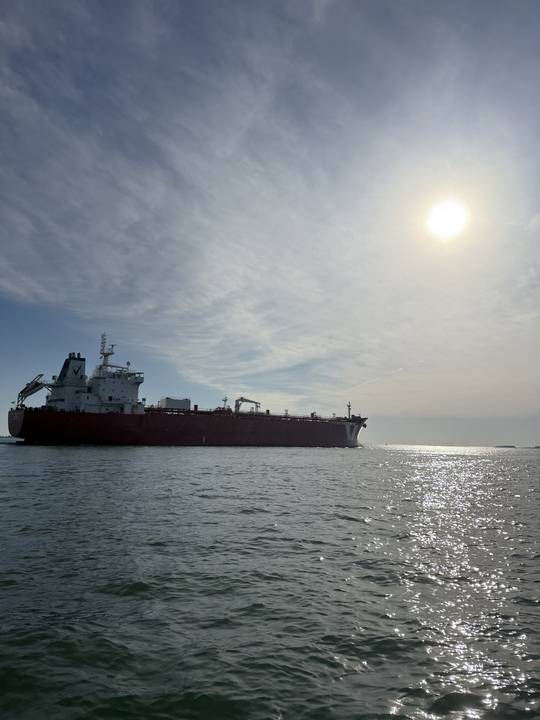 A tanker outbound into the afternoon sun