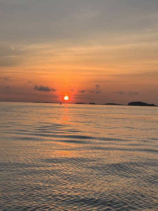 The sun going down behind the harbor islands